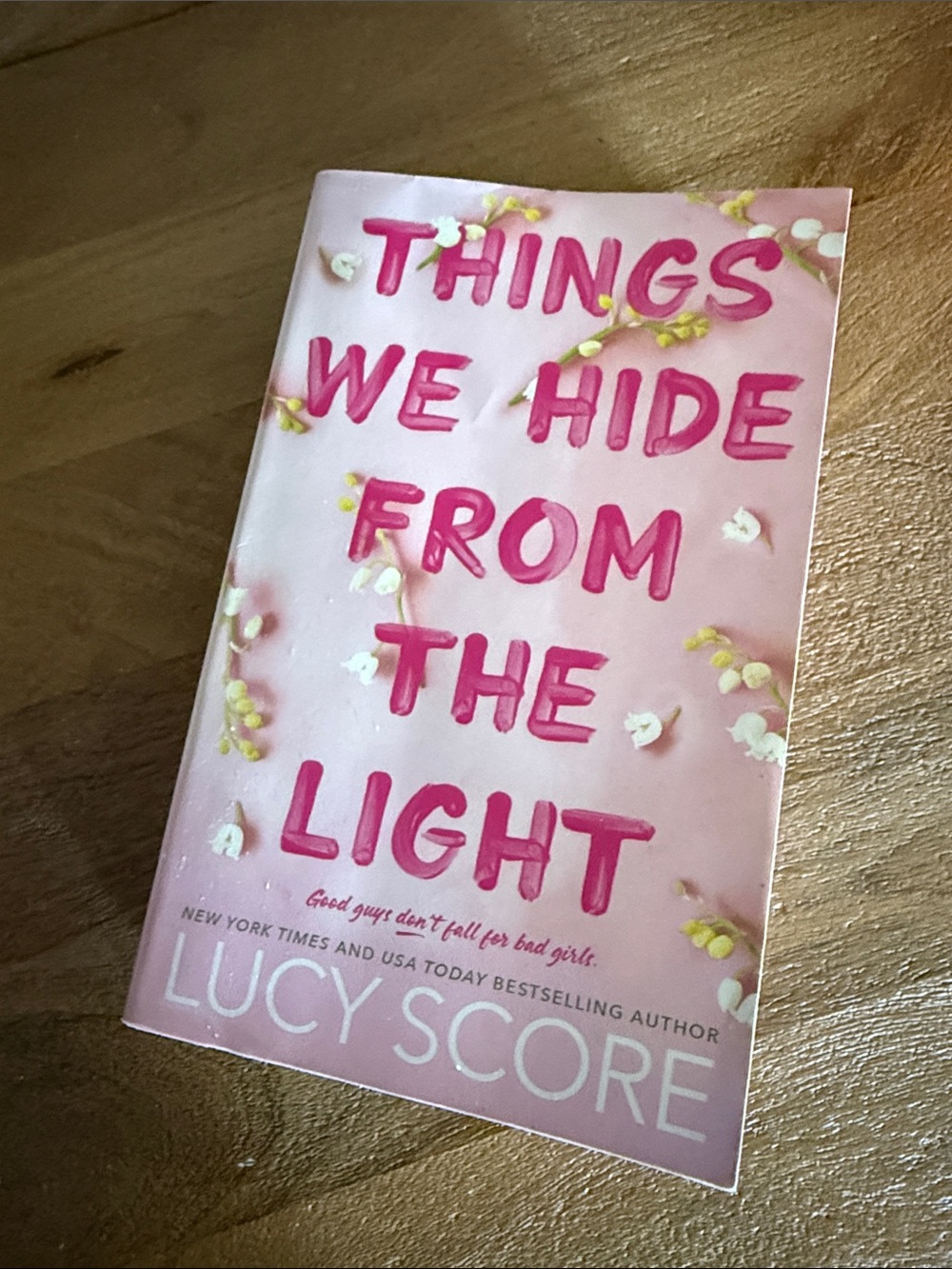 Things We Hide From the Light by Lucy Score - Pink Paperback